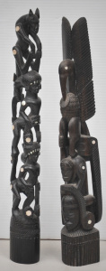 Lot 121 - 2 Trobriand ebony totemic carvings with shell inlay - taller 45cm H -