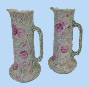 Lot 189 - Pr c1900 Japanese moriage ware Jugs featuring pink flowered and lace