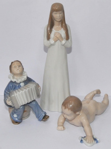 Lot 184 - 3 x Royal Copenhagen porcelain child figurines inc a baby, an accordio
