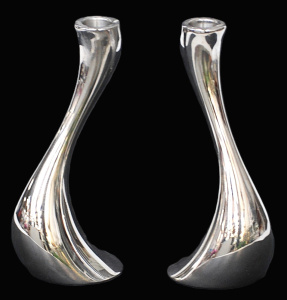 Lot 208 - Pair Georg Jensen Cobra design Candlesticks - Polished chrome 20cm H