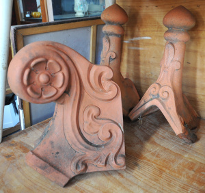 Lot 20 - Pair (55cm H) and one other vintage terracotta roof finials