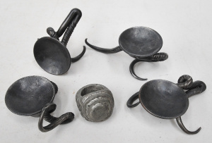 Lot 88 - Set of 4 hand forged wrought iron candle holders (larges 14cm W) and an