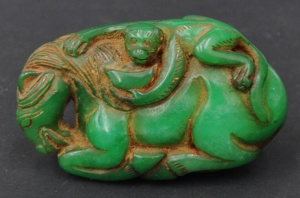 Lot 139 - Vintage Chinese jade carving of a monkey on a sleeping horse - 9cm L