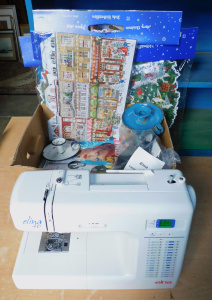 Lot 015 - Box plus inc Elna Elina 40 Sewing machine, Metal enamel chambersticks,