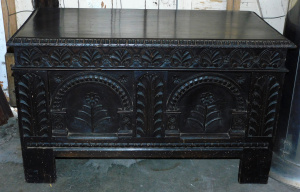 Lot 042 - Impressive vintage Maltese ebonised teak chest heavily carved in flora