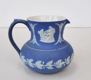 Lot 209 - Vintage Wedgwood Jasperware jug with Classical scenes and oak leaf and
