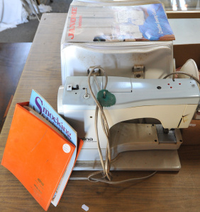 Lot 034 - 2 x pieces - Janome overlocker with case and Elna sewing machine - bot