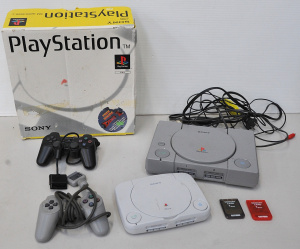 Lot 050 - Boxed original Sony Playstation with cables, controller and 2 memory c