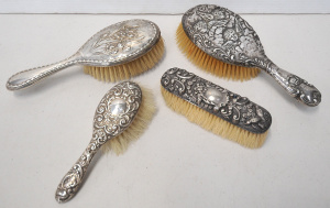 Lot 218 - 4 x Hallmarked Sterling silver Brushes - Cupids, Floral & Repousse