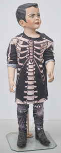 Lot 080 - Child mannequin - Boy wearing Goth clothing, with stand 90cms H