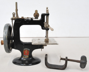 Lot 121 - Vintage Miniature Toy Peter Pan Model D Sewing Machine w Original Tabl