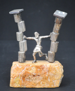 Lot 133 - Israeli silver wrapped figure of Samson pushing over the columns of th