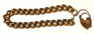 Lot 182 - 9ct vintage curb link Bracelet with heart locket - approx 26 4 grms TW