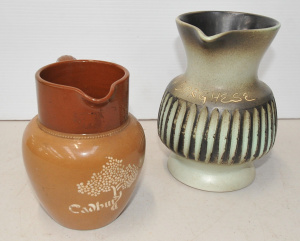 Lot 171 - 2 x vintage Pottery Jugs w Advertising - unmarked Eilis Australian Pot