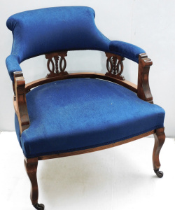 Lot 12 - Edwardian oak Parlor chair with blue velvet upholstery and metal castor