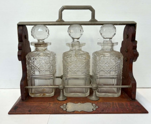 Lot 104 - c1900 oak Tantalus with three hobnail cut decanters, 1af, locked, no k
