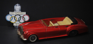Lot 118 - 2 x pieces - Vintage Melbourne 1956 Olympics Car Grill Badge + old Tin