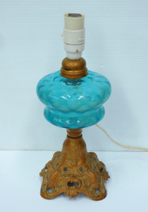 Lot 121 - Electrified Victorian oil lamp with cast iron base and blue glass font