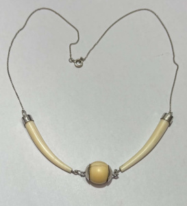 Lot 175 - Vintage silver necklace with pair fine tusks either side of ivory ball