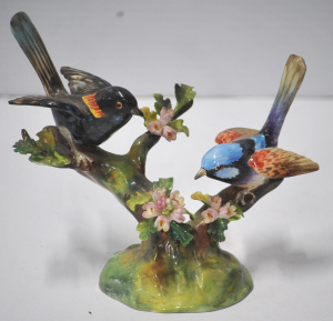 Lot 218 - Vintage Crown Staffordshire figural group of two birds on branches wit