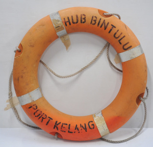 Lot 26 - Vintage orange plastic life preserver ring signed Hub Bintulu Port Kela