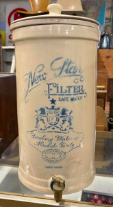 Lot 56 - c1900 New Star ceramic water filter with lid, filter and bung approx 5