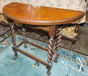 Lot 86 - Jacobean Revival demilune oak fold out games table w barley twist legs