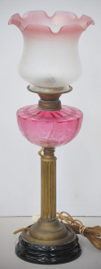 Lot 114 - Electrified Victorian oil lamp with black lacquered and brass fluted c