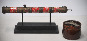 Lot 129 - Vintage Chinese brass chased ceramic pipe on stand (48cm L) and vintag