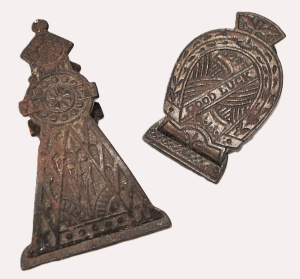 Lot 050 - 2 x vintage cast iron paper clips (c1900, larger 11cm L)), leather and