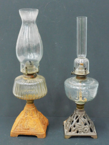Lot 068 - 2 x Victorian oil lamps w patterned pressed glass fonts and cast iron