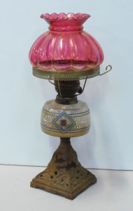 Lot 111 - Victorian Ruby Glass Twin Bruner oil lamp - Hand Painted Font, Pierced
