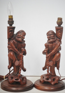 Lot 190 - Pair of vintage Chinese rosewood figural table lamps depicting Taoist