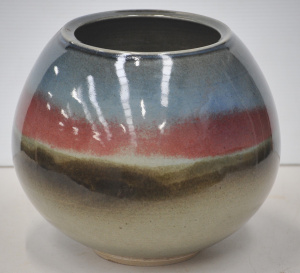 Lot 192 - Large Tony Carlin Australian Pottery jardinire depicting stylised sun