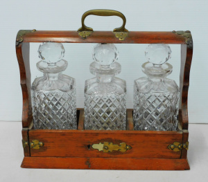 Lot 196 - Vitnage oak and brass tantalus w 3 decanters - 35cm W