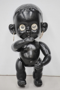 Lot 116 - 1950s black plastic Winky Doll, with earrings, made in HK, 24cms H gc