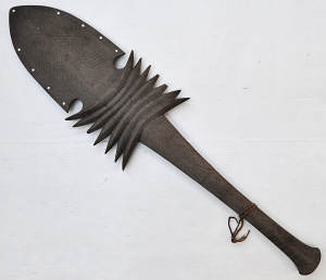 Lot 118 - Vintage intricately carved Polynesian hardwood broad bladed paddle clu