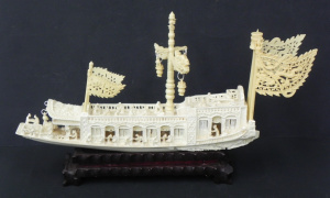 Lot 203 - Carved Simulated Ivory Chinese Pleasure boat with two tier wooden stan