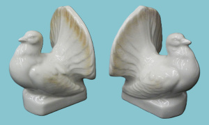 Lot 204 - Pair vintage Art Deco Style Pouting Pidgeon Book Ends - white w slight