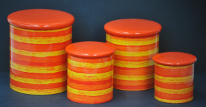 Lot 211 - Retro Willow Australia set of 4 Graduating Tin Cannisters Orange, Red