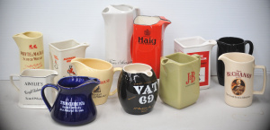 Lot 086 - Group lot Vintage Ceramic Whisky Jugs inc Wade - Vat 69, Whyte & M
