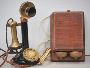 Lot 112 - Vintage brass and black enamel candlestick telephone with copper plaqu