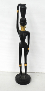 Lot 120 - Ebonised and gilt Figure of a stylised nude African woman with gold je