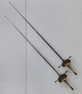 Lot 126 - Pair of vintage decorative rapiers with intricately etched guards and