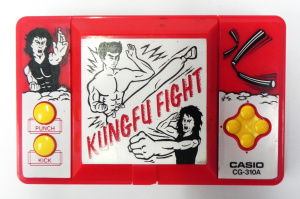 Lot 165 - Vintage Casio hand held Kids Computer Game - Kung Fu Fight - flip up t