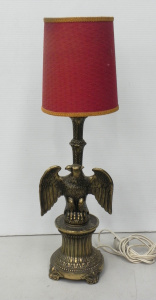 Lot 008 - Brass spread eagle table lamp with red textured cloth shade - 56 5cm H