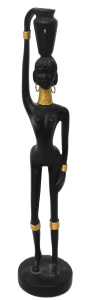 Lot 125 - Ebonised and gilt Figure of a stylised nude African woman with gold je