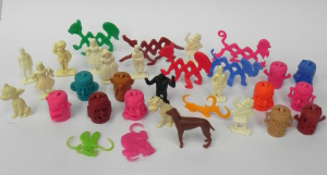 Lot 165 - Cereal Toys Totem Tribe, Stretch Pets, Miniature National Costumes etc