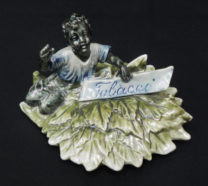 Lot 206 - Vintage opalescent ceramic tobacco jar lid depicting a plantation work