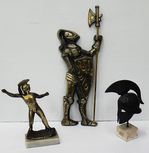 Lot 169 - Miniature bronze Greek hoplite helmet, brass statuette of a Greek warr
